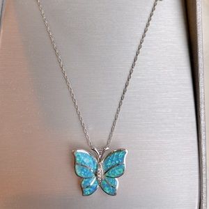 Lab created Blue and White Sapphire Butterfly Pendant in Sterling Silver.